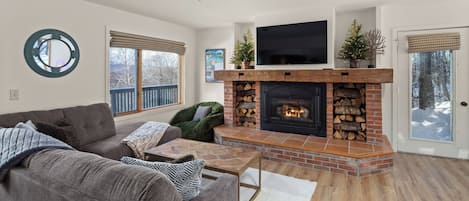 Relax by the fireplace after a fun day on the mountain