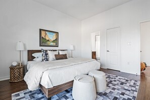 View of the cozy bedroom, featuring comfortable furnishings and a warm, inviting atmosphere.
