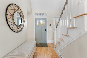 A welcoming foyer features warm and hardwood floors.