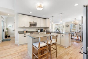 Seamless flow into the dining area makes entertaining effortless.