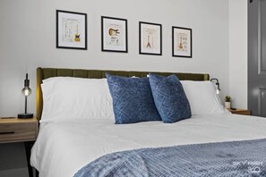 Spacious King Size Bed with fluffy pillows, ready for maximum comfort and relaxation.