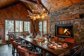Dining room comfortably sits 10, fire place, terrace access, view of woods