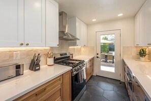 Full kitchen features a coffee maker, basic cooking essentials you’ll need