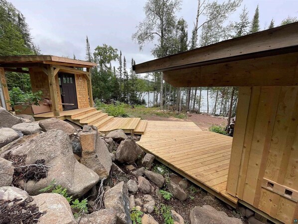 Our bunkhouse (right) and heated outhouse (left).
