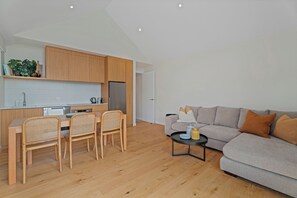 Living area with lounge, dining table (seats 6) and well equipped kitchen.