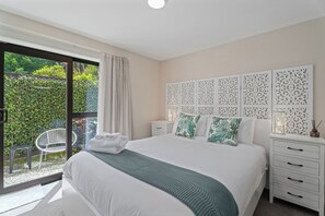 Comfortable queen bed for a great nights rest. Private patio area can be accessed through the slider