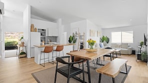 Experience the perfect blend of style and functionality in this open-plan space, where the modern kitchen, elegant dining area, and cosy living room flow seamlessly together for easy living and entertaining.