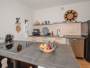 Countertop, Kitchen, Furniture, Flooring, Kitchen Appliance, Interior Design, Cabinetry, Floor, Home Appliance, Major Appliance