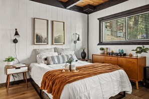 Rustic Bedroom with Plush Comfort - Highlighting the cozy bedroom with warm accents, offering the ultimate mountain retreat ambiance.