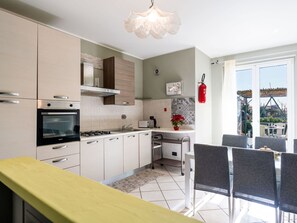 Furniture, Interior Design, Flooring, Kitchen, Countertop, Wood, Cabinetry, Floor, Kitchen Appliance, Ceiling