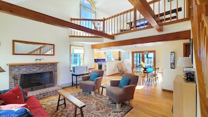 Open main living area with vaulted ceiling in living room
