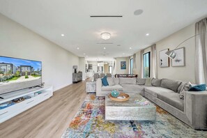 Gather around the Smart TV for movie nights or dive into board games and foosball for family fun.