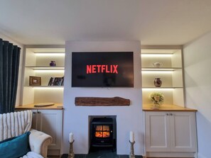 Enjoy movie nights or good conversation in this inviting living room.