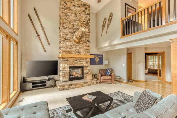 Cozy up and enjoy! This living room features a fireplace and plenty of space to relax.