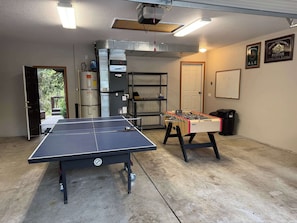 Get your competitive side going with ping pong and foosball in the garage!