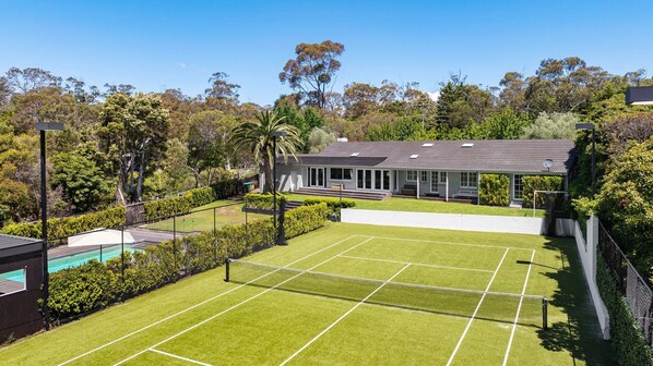 Stunning tennis court, solar heated pool and secure yard 