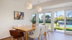 Dining area with  the pool and garden view