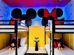 Disney-themed bedroom with Mickey and Minnie Mouse.