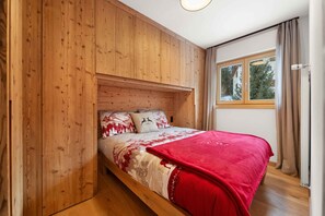 First double bedroom enveloped in the warmth of wood.