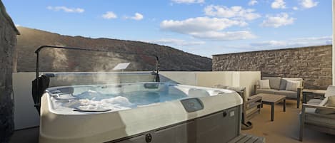 Relax in the private roof top hot tub!
