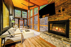 Screened-In Porch: Unwind by the fireplace with nature's beauty all around! Perfect for relaxation!