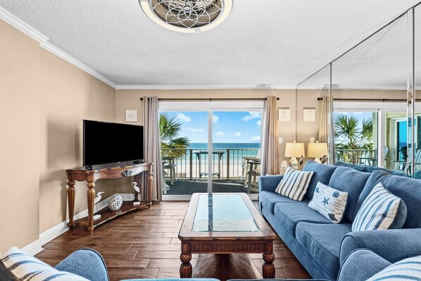 Comfortable living space with Smart TV, balcony access and stunning view
