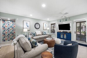 Family Room looking towards hall. All TV's are Smart
