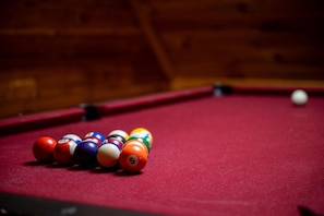 Challenge friends and family to a game of pool in the game room