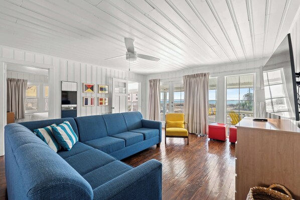 Unwind in the cozy living room, featuring a pull-out couch for extra sleeping space and a Smart TV for all your entertainment needs. Perfect for relaxing after a day at the beach!