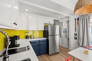 Fully equipped kitchen with Keurig (starter K-cups & sugar included), fridge, 2-burner stovetop, microwave, cookware, and dining for two. Plus, toaster, kettle, blender, -Just bring your favorite extras! Grocery store 5 mins away.