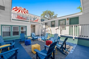Relax in our shared courtyard, featuring comfortable outdoor furniture—perfect for lounging and enjoying the fresh air between the condos.