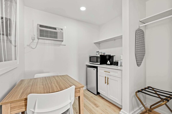 Kitchenette with fridge, microwave, & Keurig coffee maker.  We include a started supply of coffee, sugar & powered creamer. 