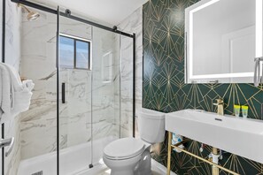 Private bathroom with spacious walk-in shower | Palm Court #14