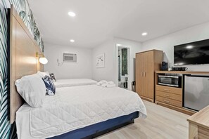 Essentials like a mini fridge, toaster, Smart TV, WiFi, and a newly installed walk-in shower are easily accessible in the room for your convenience.