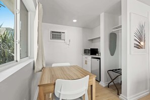 Enjoy a cozy table for two, perfect for dining or relaxing together.