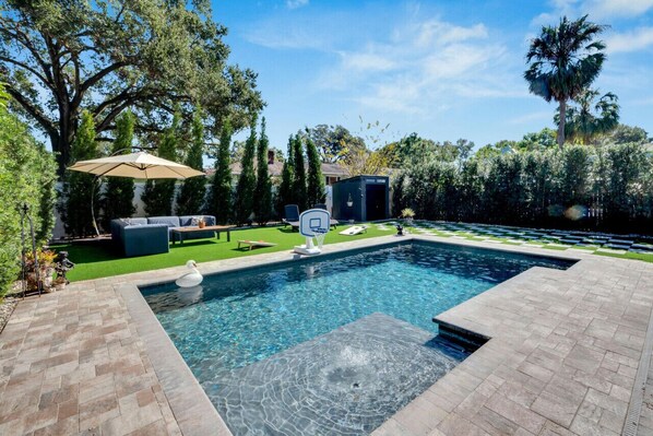 Pristine Backyard with Pool, Grill, and Games