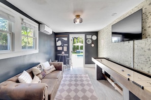 Prohibition-era elegance with shuffleboard and classic 1920s style.
