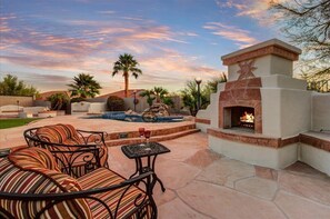 Two cozy oversized stuffed chairs in front of Gas Fireplace for relaxing.