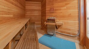 Step into this serene sauna and experience pure relaxation, surrounded by warm wood tones and a calming ambiance.