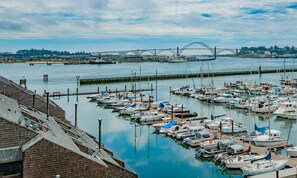 Overlook the vibrant marina from the comfort of your suite, with boats gently swaying in the calm waters below.