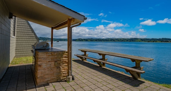 Relax at this cozy picnic spot, offering a perfect place to dine while enjoying the waterfront views.