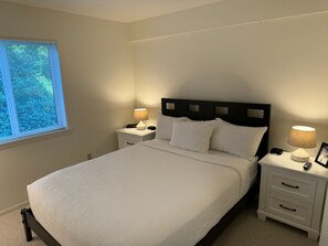 Rest peacefully in this cozy bedroom, where soft lighting and a serene atmosphere create a restful retreat.