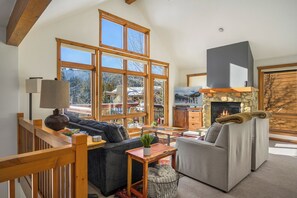 Living area with a fireplace and a flat screen TV