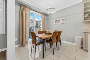Elegant dining area with seating for six, perfect for meals and gatherings.
