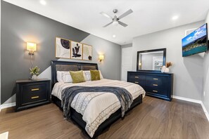 Spacious master bedroom featuring a luxurious king-size bed.