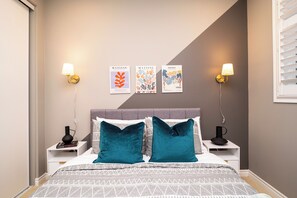 Thoughtfully designed with cozy bedding and decorative pillows.