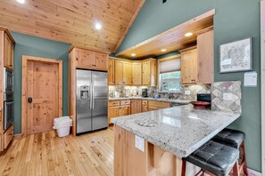 Kitchen: Main floor, drip coffee maker, Keurig, toaster, cooking utensils, tableware
