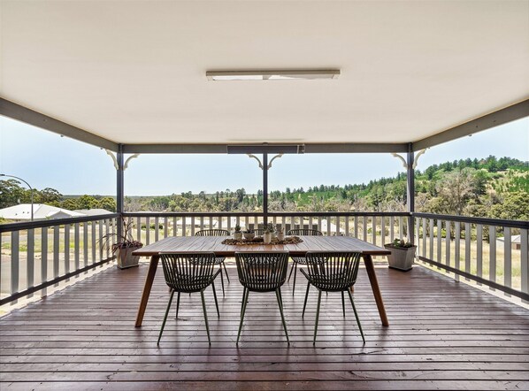 Breathe in the fresh air from the wraparound veranda, complete with a BBQ and sweeping views of the hills.