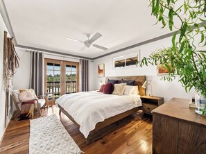 A dreamy primary bedroom with a king bed, soft linens, and direct access to the veranda for tranquil mornings.