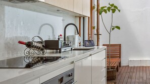 Fully equipped kitchen with stove, oven, sink, and all the cookware you need.